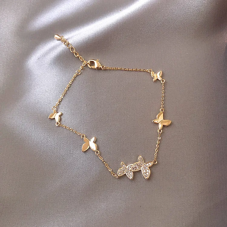 Butterfly Whispers: Luxurious Gold Bracelet with Crystal Accents