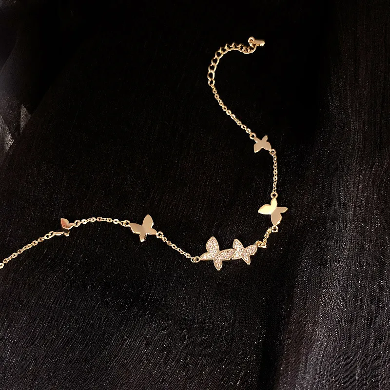 Butterfly Whispers: Luxurious Gold Bracelet with Crystal Accents