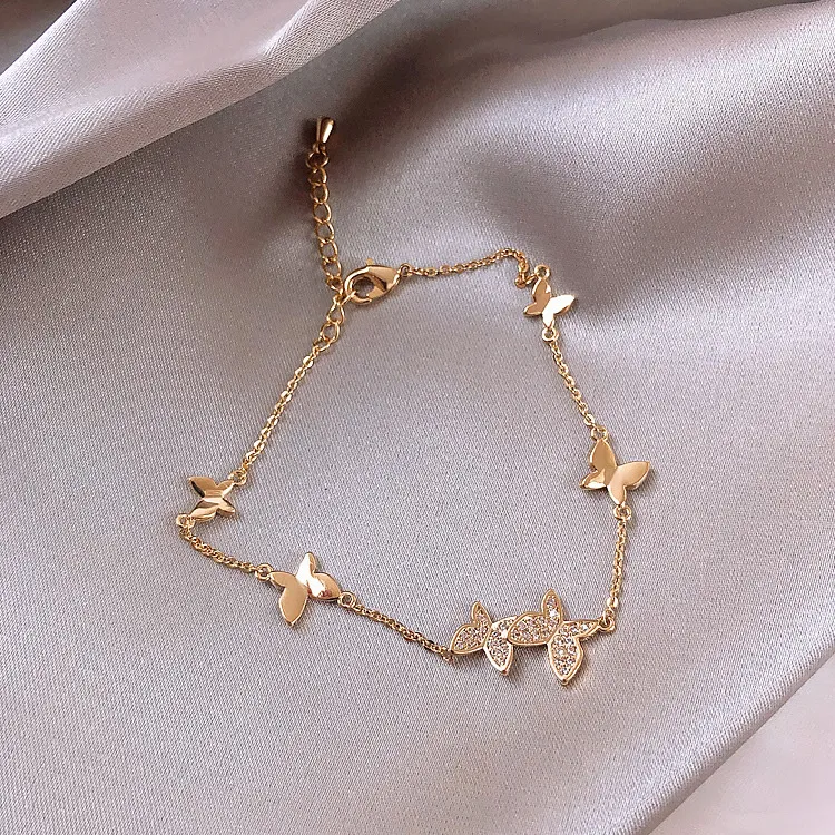 Butterfly Whispers: Luxurious Gold Bracelet with Crystal Accents